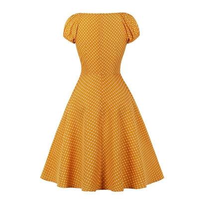 Kleid im Stil der 50er Jahre mit gelben Punkten
