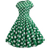 Ausgestelltes grünes Vintage-Kleid mit weißen Tupfen