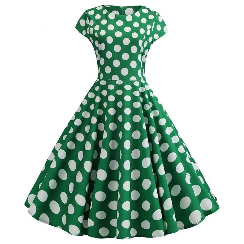 Ausgestelltes grünes Vintage-Kleid mit weißen Tupfen