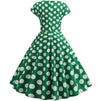 Ausgestelltes grünes Vintage-Kleid mit weißen Tupfen