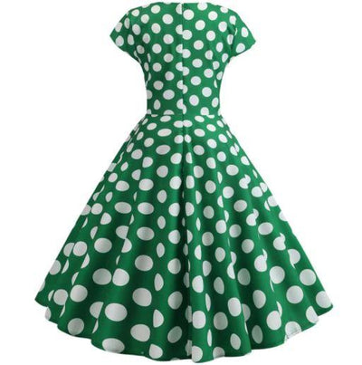 Ausgestelltes grünes Vintage-Kleid mit weißen Tupfen