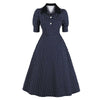 Marineblaues, gepunktetes Vintage-Kleid