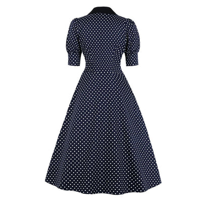 Marineblaues, gepunktetes Vintage-Kleid