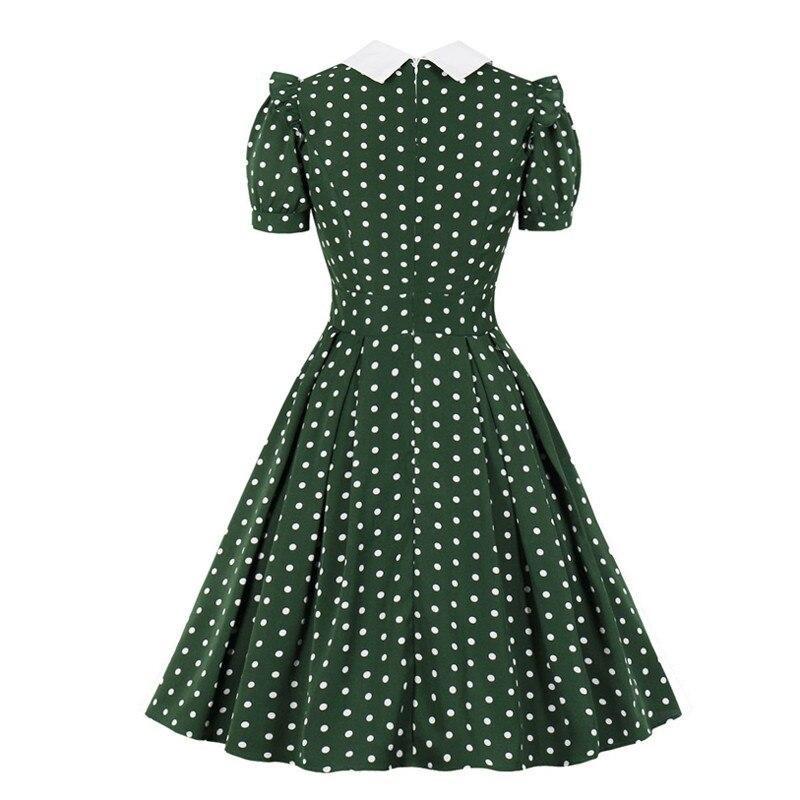 Grünes gepunktetes Vintage-Kleid
