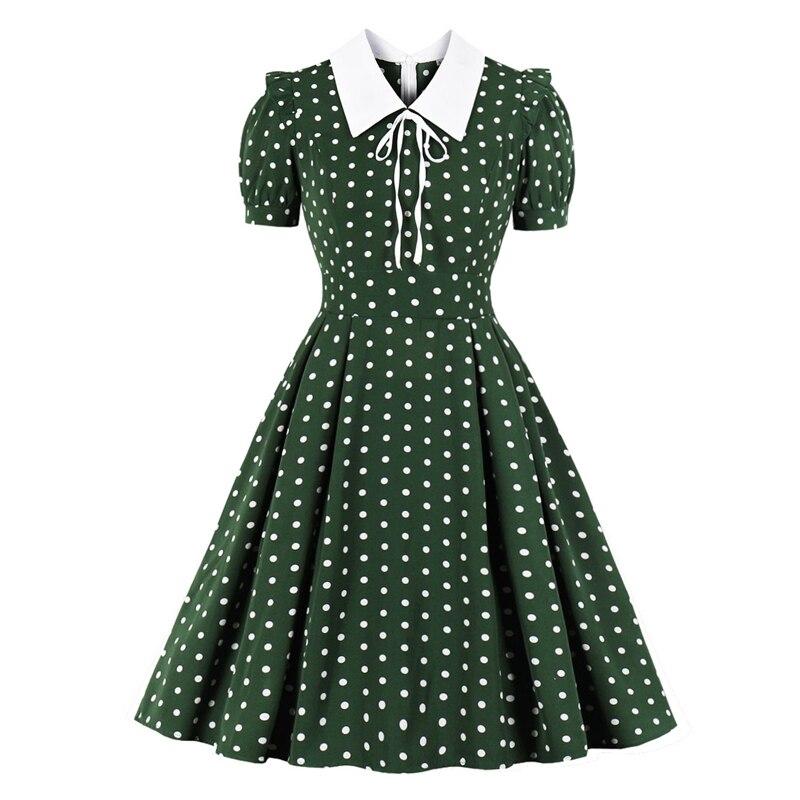 Grünes gepunktetes Vintage-Kleid
