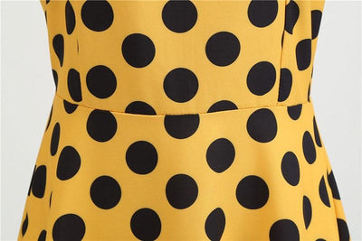 Gepunktetes gelbes Rockabilly-Vintage-Kleid